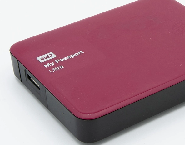 Western Digital (WD) My Passport Ultra portable external hard drive in red, featuring a USB 3.0 interface for data storage and backup.