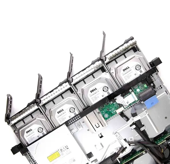 Top-down view of a Dell server chassis with four 3.5" enterprise hard drives partially ejected, revealing internal components and cabling.