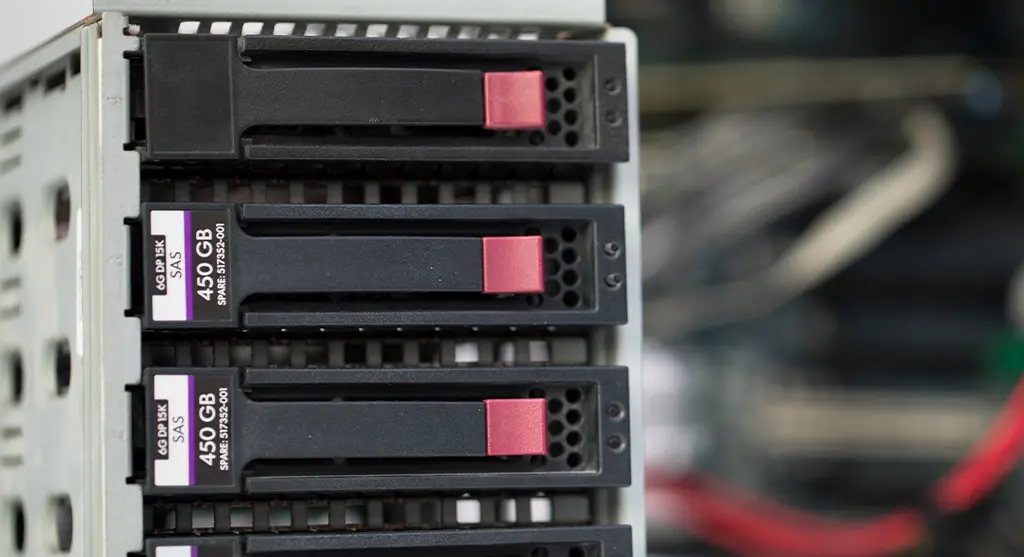 Close-up view of multiple 450GB 15K SAS hard drives installed in a server drive bay.